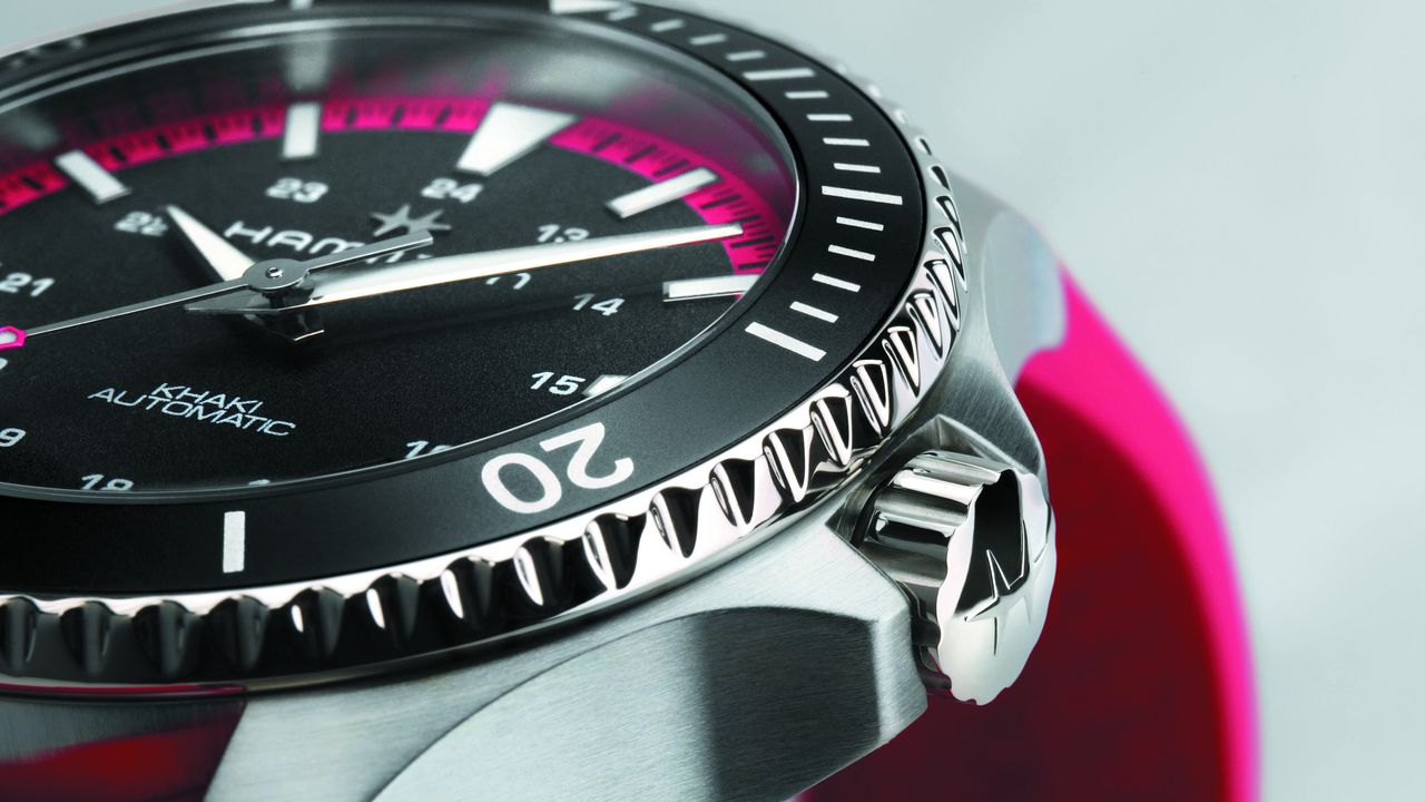 The Hamilton Khaki Navy Scuba in pink on a white background