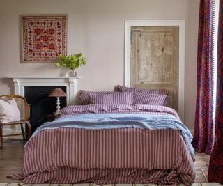 Amberley Stripe bedding on a bed.