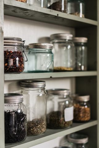 Pantry shelves with glass jars