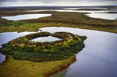 A collapsed pingo, thus creating the pingo pond. Credit: Getty Images