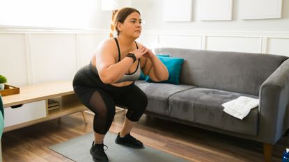 Woman holding a squat