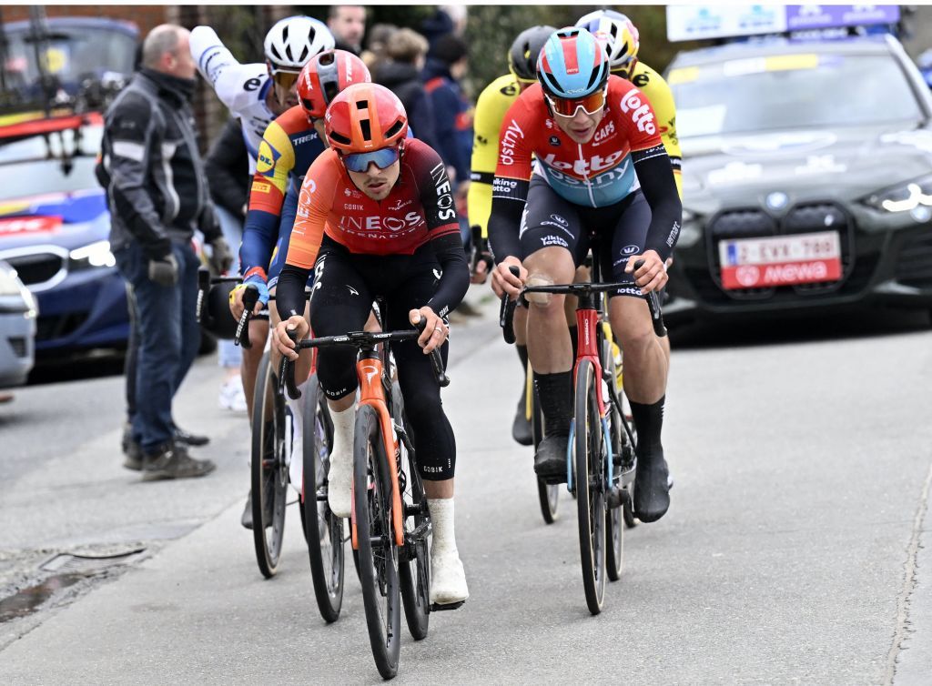 British Tom Pidcock of Ineos Grenadiers and Belgian Arnaud De Lie of Lotto Dstny pictured in action during the 79th edition of the men's one-day cycling race Omloop Het Nieuwsblad (UCI World Tour), 202km from Gent to Ninove, Saturday 24 February 2024. BELGA PHOTO DIRK WAEM (Photo by DIRK WAEM / BELGA MAG / Belga via AFP)