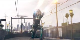 Brie Larson firing energy blast on a train in Captain Marvel