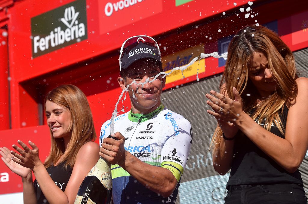 Caleb Ewan spraying the podium Cava