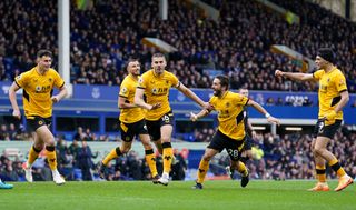Conor Coady, centre, celebrates scoring Wolves' winner at Everton