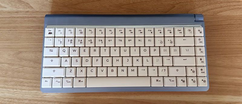 Wombat Coleus mechanical keyboard on a wooden desk