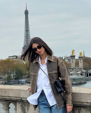 french woman wearing brown leather jacket outfit