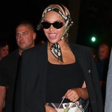 Beyoncé wears a Pucci printed bag and headscarf