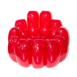 A bright red JELL-O shaped inflatable chair