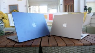 MacBook Air 15-inch M3 next to MacBook Air 13-inch M3 on a side table