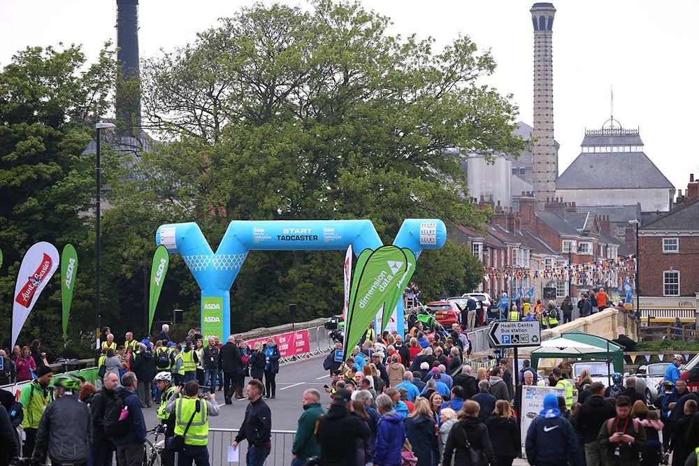 Fans wait for the Tour de Yorkshire to pass by