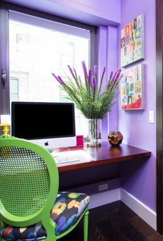 home office painted in lilac with seafoam green chair
