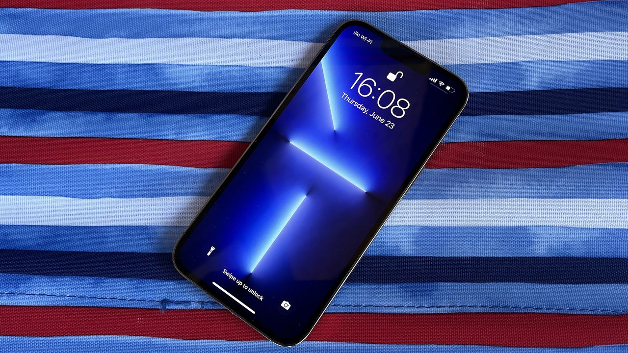 iPhone 14 phone on stripy cloth