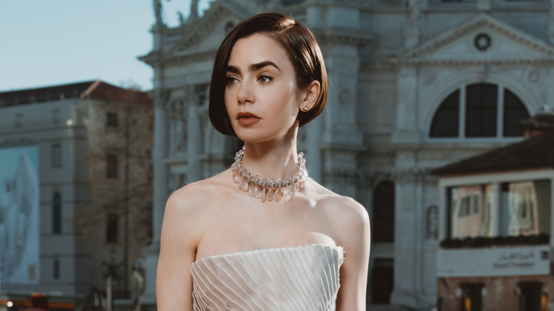 Lily Collins wearing a Schiaparelli Haute Couture gown at the Emily in Paris season 5 photocall