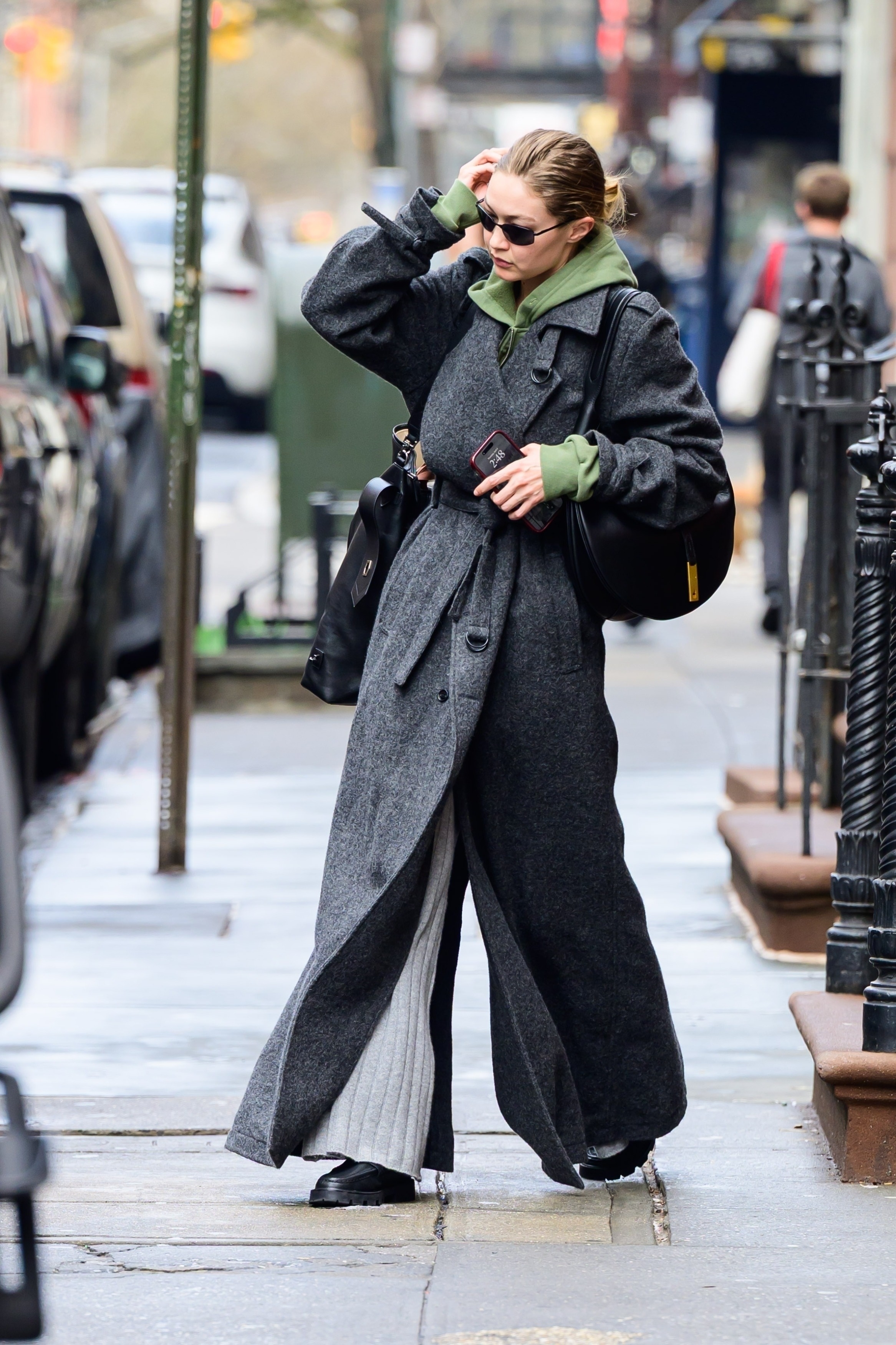 Gigi Hadid wears her Ralph Lauren Polo ID bag.