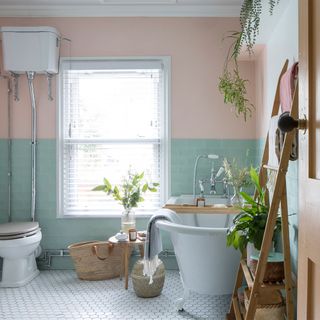 pink and green bathroom with freestanding bath