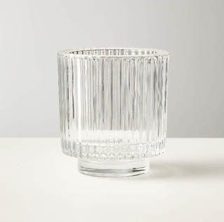 Ribbed glass tealight candle holder.