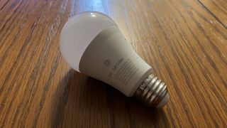 GE Cync Lighting Dynamic Effects Smart Bulb on wooden table