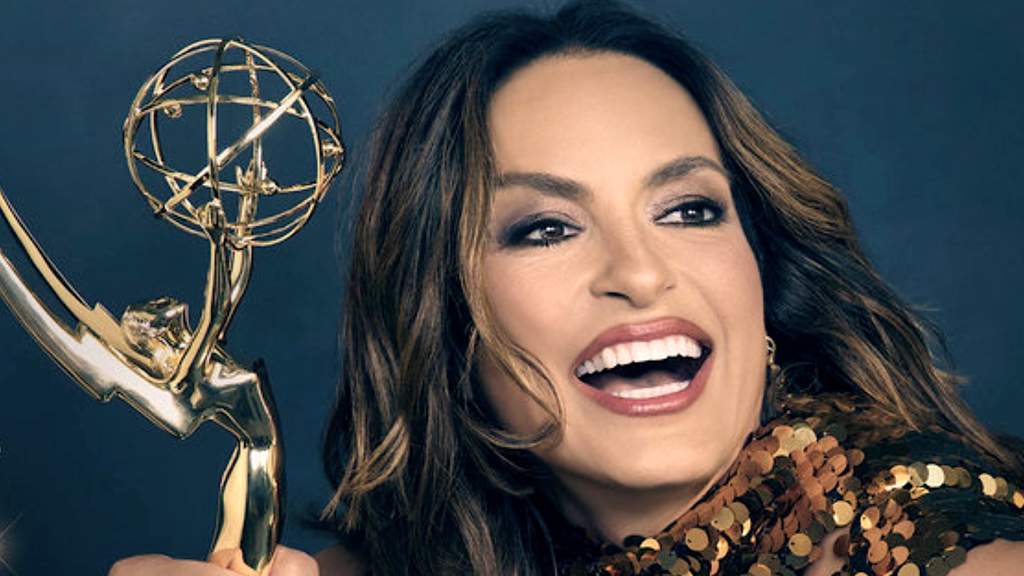 Mariska Hargitay smiling and holding an Emmy trophy in promo for 2026 Emmy Awards