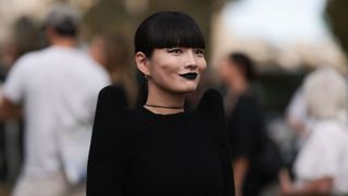 model wearing bold lipstick at Fashion Week