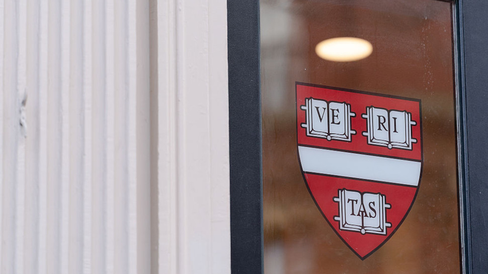 Logo of Harvard University on a window