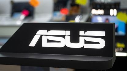 ASUS logo displayed at a promotional stall in a store in Hong Kong.