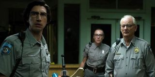 The Dead Don't Die Adam Driver, Chloe Sevigny, and Bill Murray staring at a zombie in their police d