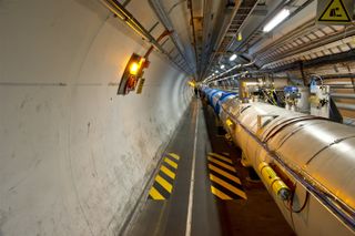 The LHC tunnel where particles accelerate.