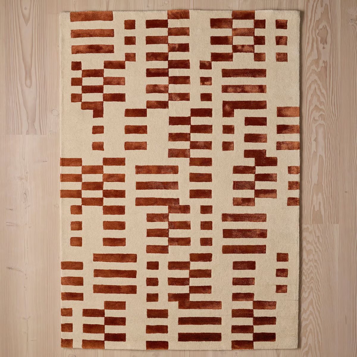 Rust colored geometric rug