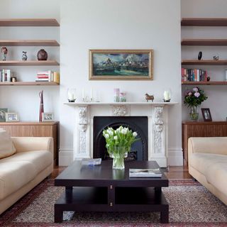 Living room with white walls and firepplace