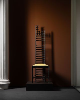 orange walls with black chair