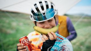 Mountain biker with can of coke and banana