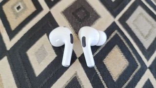 A side by side comparison of the AirPods 3 and AirPods Pro wireless earbuds