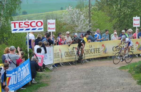 Dan Craven slides into the barriers in Owston but stays upright.