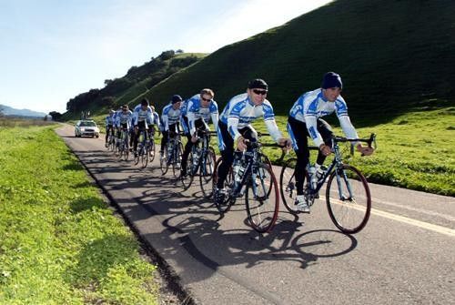 Ex-mountain bike star Ryder Hesjedal tucks in behind Great Britain's strongman, Roger Hammond, as the group stretches out.