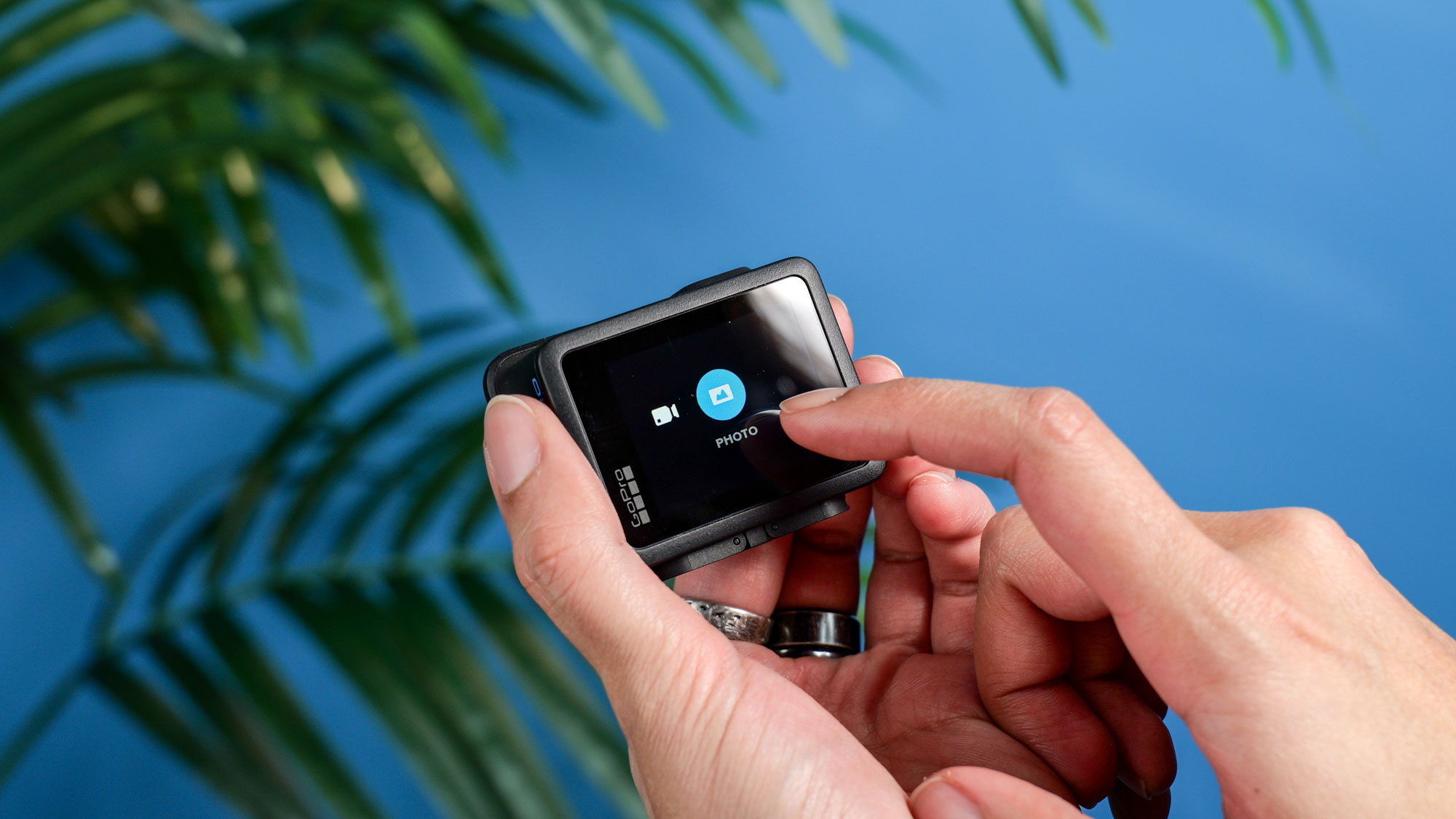 The GoPro Hero (2024) in hand with the screen in use