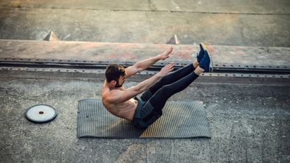 Man performs a V-sit