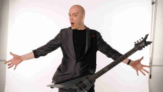 Devin Townsend posing for a photograph in 2012