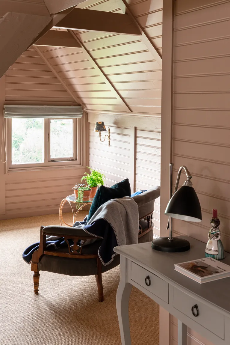 pink bedroom with pink painted shiplap walls and ceiling