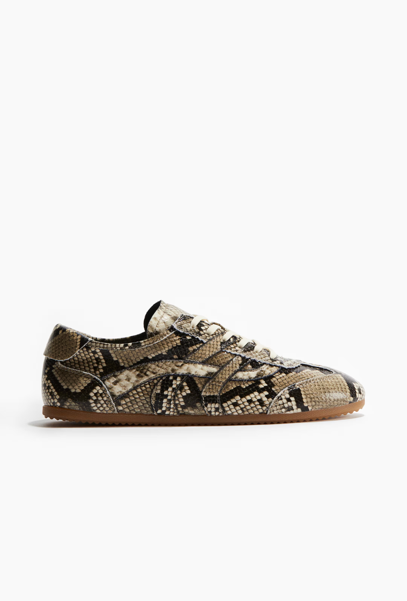 An image of snakeskin trainers from H&amp;amp;M.
