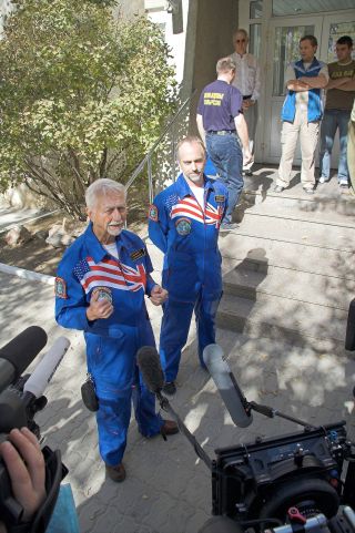 Owen Garriott (left) with his son, Richard, talks to the media prior to Richard's launch to the International Space Station in 2008.