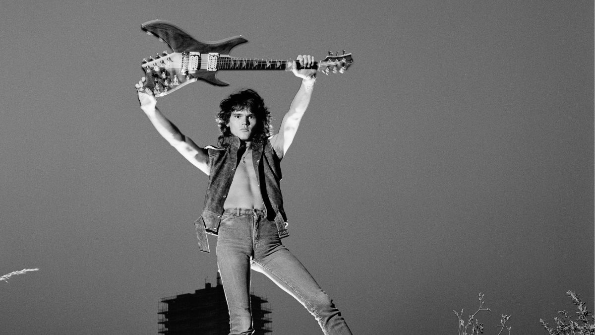 British guitarist Robin George poses with a guitar at the Royal Docks in London in July 1983