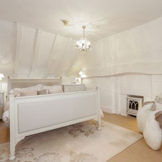 the master bedroom is tranquil room of all white
