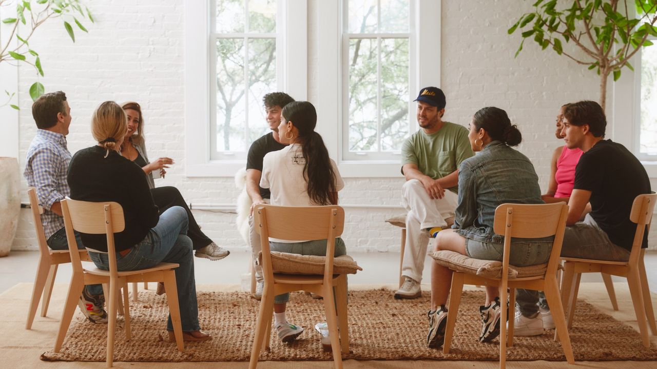 Members of Peoplehood gather for a group conversation at a Manhattan studio, led by a facilitator.