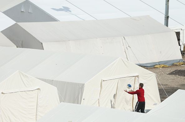 A child plays soccer at a refugee camp in Dresden, Germany.