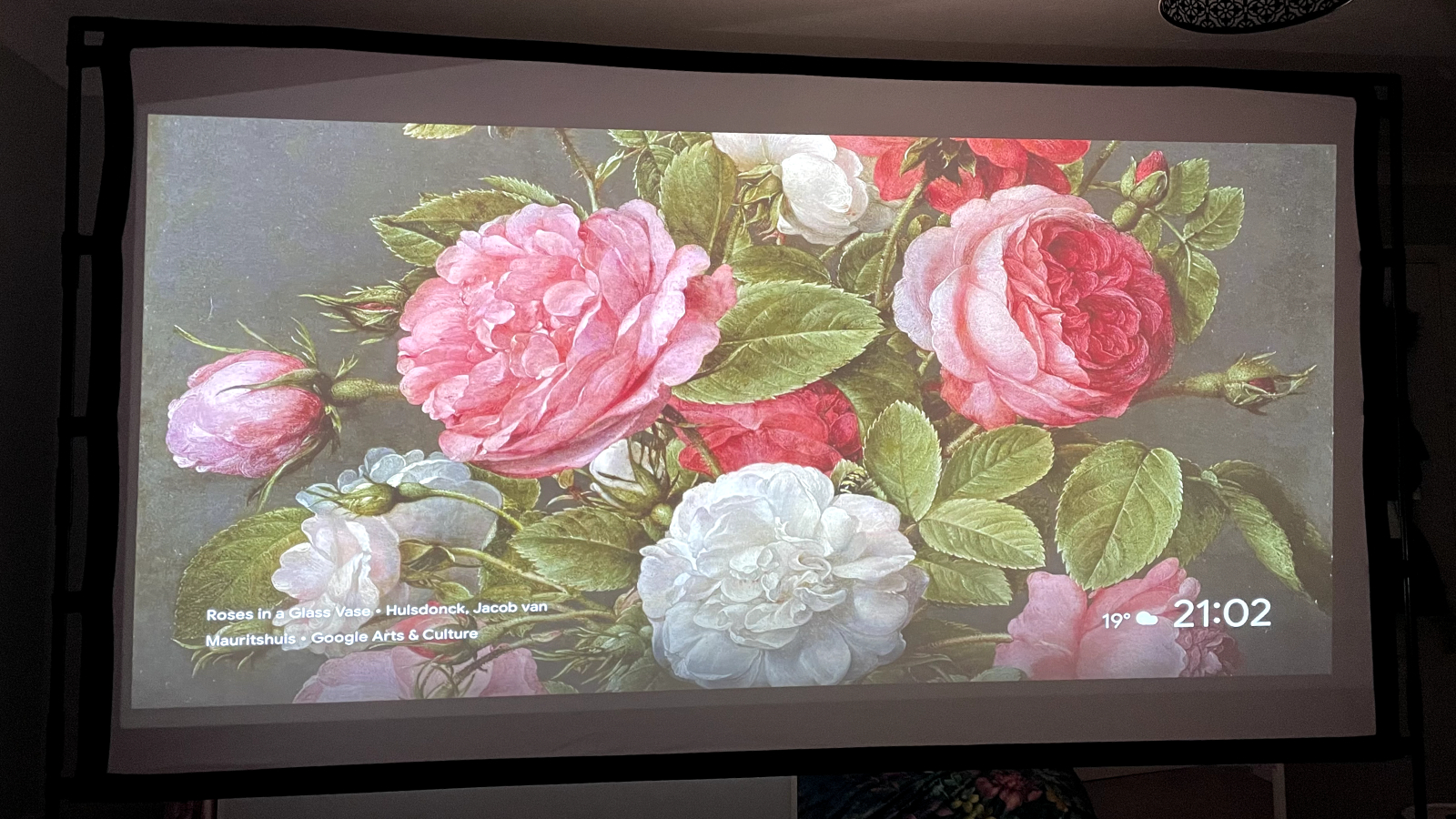 Image shows a projection of artwork by Jacob van Mauritshuis as a screensaver on a projector screen.