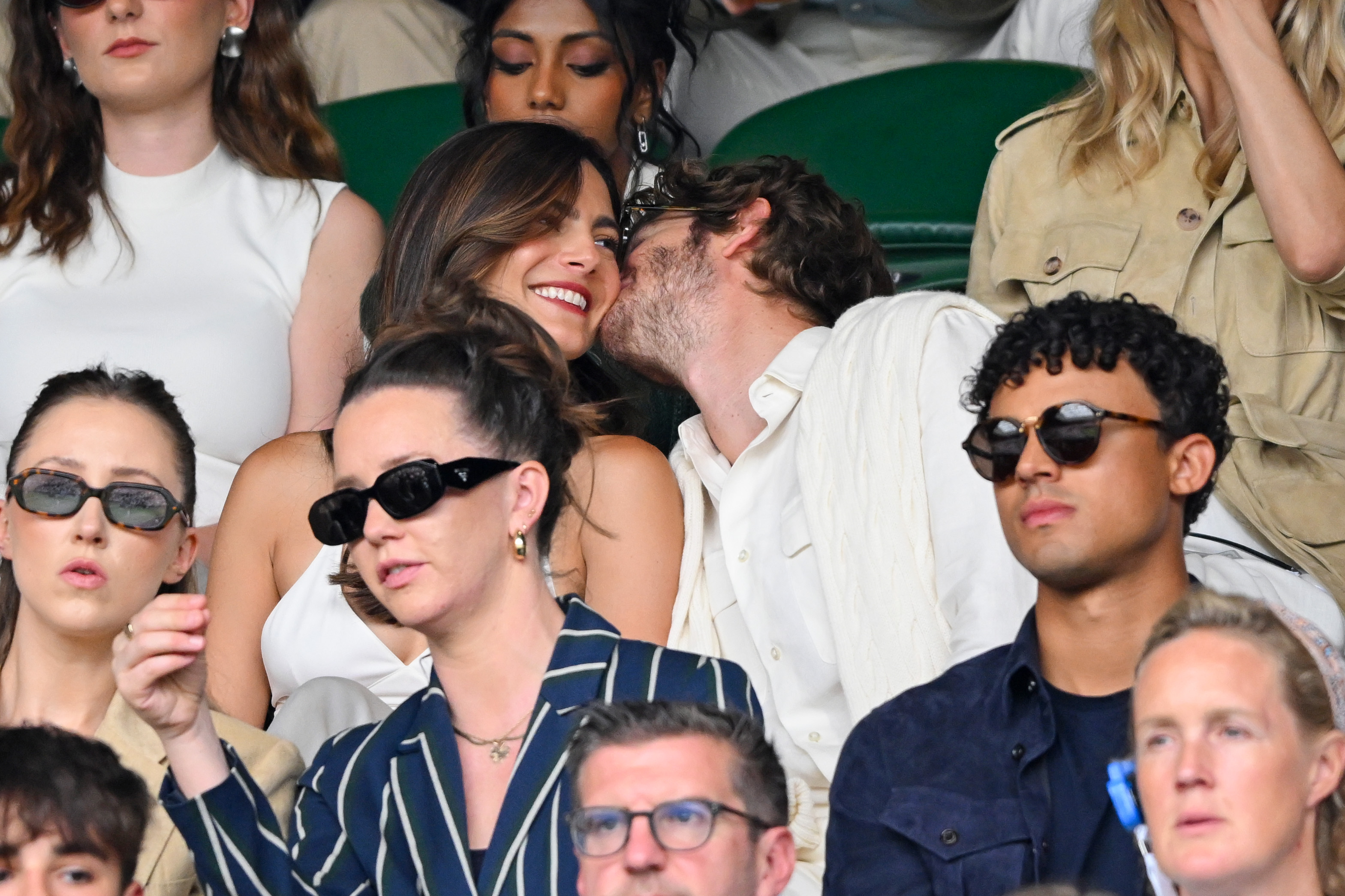 Monica Barbaro gets kissed on the cheek by Andrew Garfield at Wimbledon