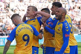 Southampton’s players celebrate scoring their side’s second goal of the game during the Premier League match at St. James’ Park, Newcastle. Picture date: Saturday August 28, 2021