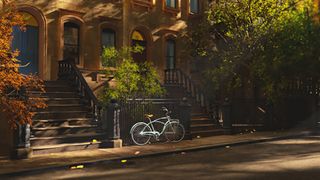 3D painting of bicycle parked next to brownstone, as part of one of the best Maya tutorials