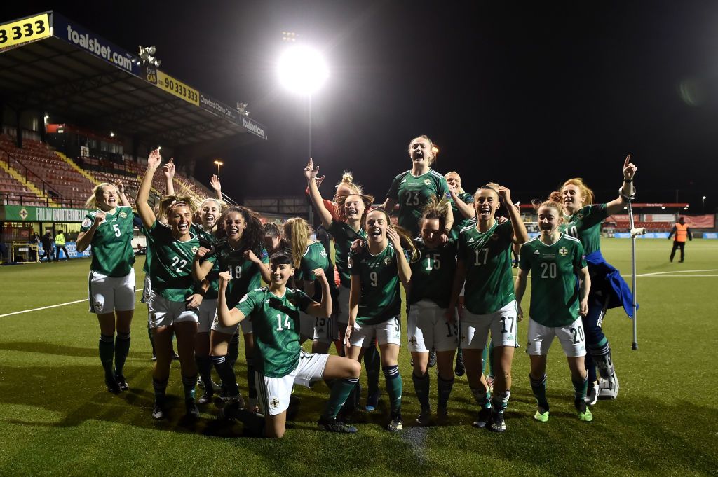 Northern Ireland players celebrate victory in the UEFA Women&#039;s Euro 2022 Play-off match between Northern Ireland and Ukraine at Seaview on April 13, 2021 in Belfast, Northern Ireland. Sporting stadiums around the UK remain under strict restrictions due to the Coronavirus Pandemic as Government social distancing laws prohibit fans inside venues resulting in games being played behind closed doors.